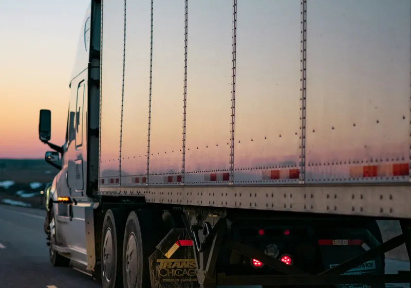 Moving truck on the highway at dusk